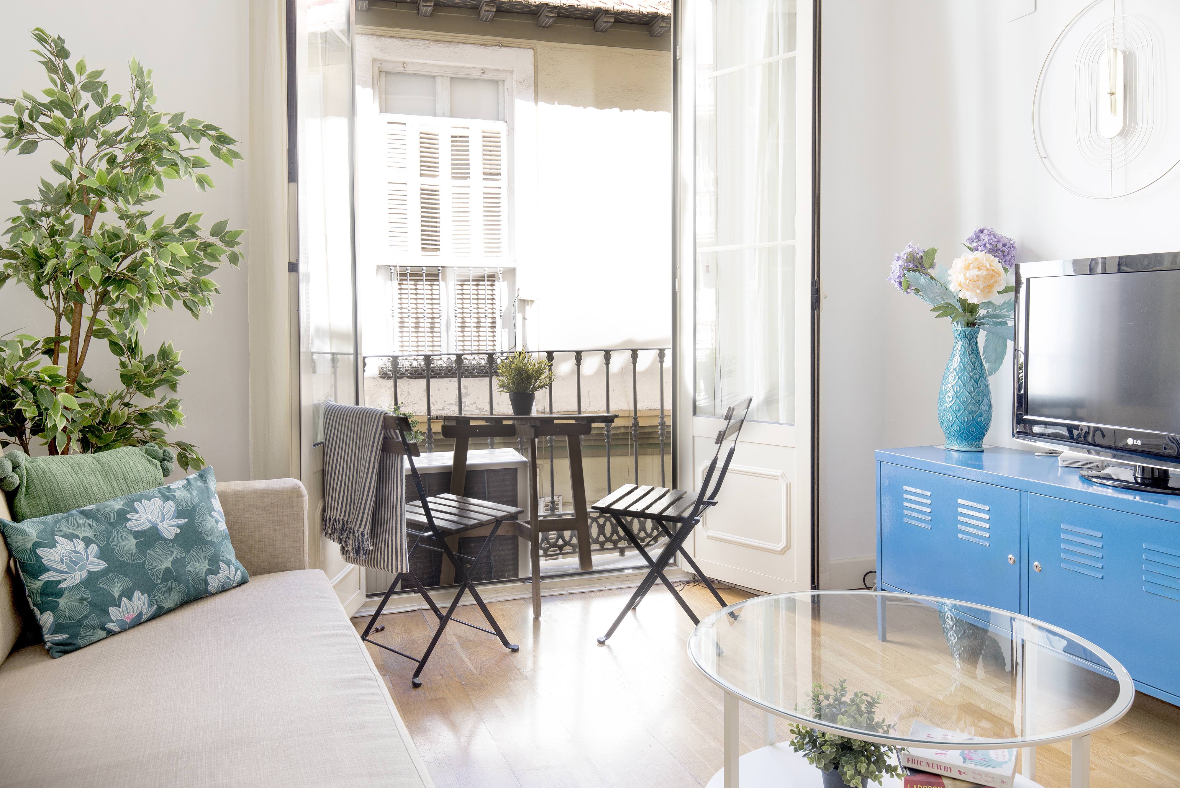 views of the living room with balcony of the beautiful apartment